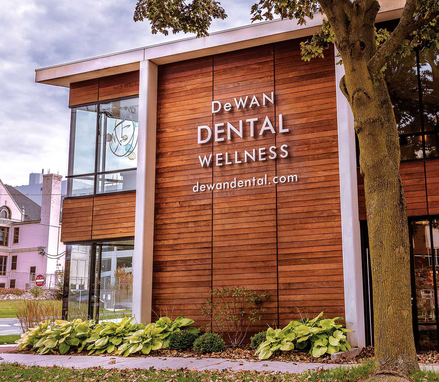 Front of DeWan Dental's office, a building with a modernist design
